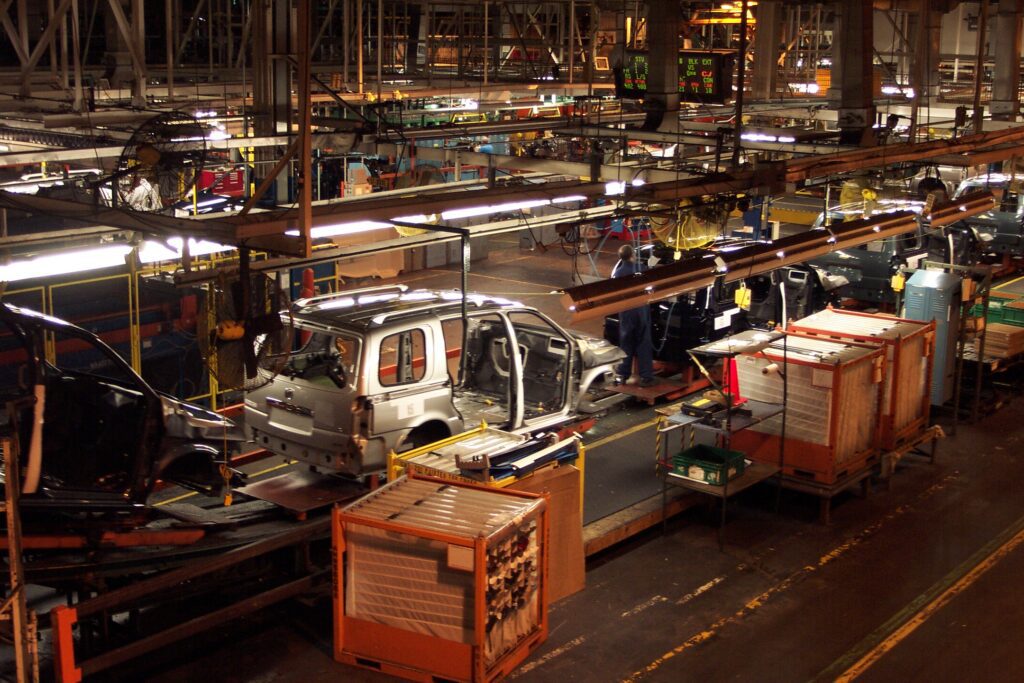 Workers assembling cars at the General Motors Assembly Plant. Photo from DeKalb History Center.