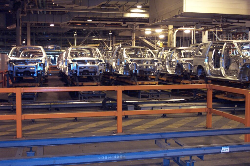 Rows of partially-assembled cars at the General Motors Assembly Plant. Photo from DeKalb History Center.