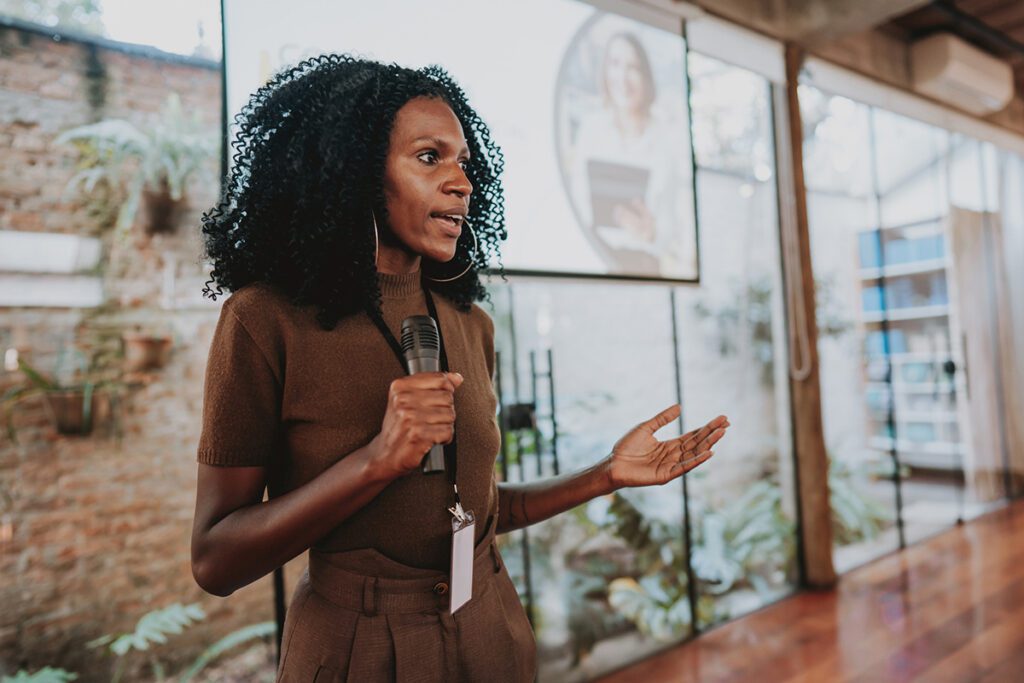 Woman giving speaker presentation