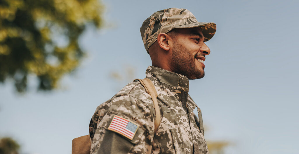 Smiling young soldier returning home from the army